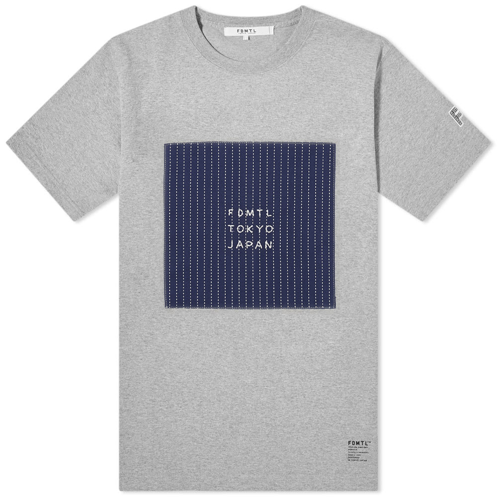 Putting a modern spin on a centuries-old embroidery technique, FDMTL presents this heather-grey tee for AW19. The cotton crewneck is cut in a street-ready style and features a navy appliqué to the chest, replete with dash stitches and signed off with sewn branding – replicating the traditional sashiko darning method. 100% CottonRibbed CrewneckAppliqué & Printed Branding