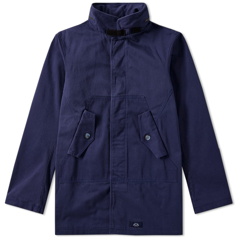 Military garments have long been a heavy inspiration for menswear with labels like Bleu De Paname authentically reproducing utilitarian staples for the modern man. Best known for their workwear entirely produced in France, the heritage-inspired label bring back the masculinity and functionality of the Fatigue jacket. Cut from a durable cotton, the outer is equipped with a packable hood for harsher weathers, secure buttoned pockets and a concealed button placket for extra protection.

100% Cotton
Concealed Button Placket
Button Side Pockets
Concealed Zip Hood
Velcro Tab Collar
Made in France