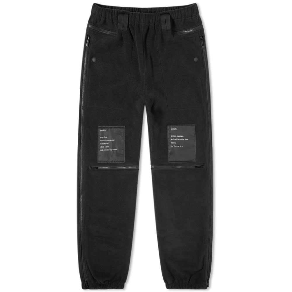 Decorated with patches that display wearable stanzas of poetry, these black joggers from TAKAHIROMIYASHITATheSoloist. are detailed with zippers throughout their dark construction. Made in Japan, the black pants are completed with elasticated edging at the waist and ankle cuffs.

100% Polyester
Fleece Fabric 
Zip Detailing
Elasticated Trims
Made in Japan