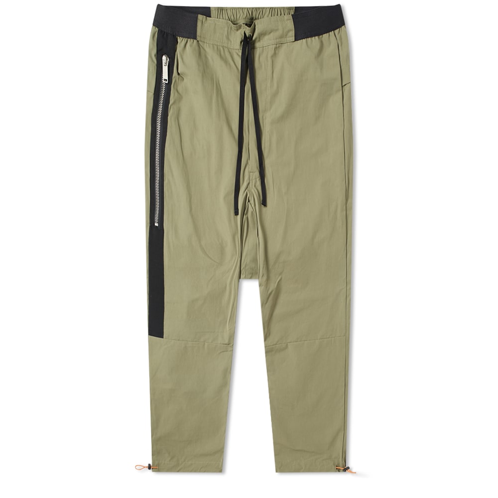 With the viewpoint that everything must first be destroyed to create something new, Unravel Project’s Ben Taverniti returns to LA’s street scene with a military take on the track pant. Applying volume to the design with the addition of several extended drawstrings, Unravel take the utility theme to new heights; enhancing the pant’s casual aesthetic with a drop crotch and adjustable fastenings. Cemented in a long-lasting khaki hued Tela fabric, this slouchy track style gets a lesson in LA utility.

100% Cotton
Tela Fabric
Elasticated Drawstring Waist
Drop Crotch
2 Side Entry Pockets
Elongated Drawstrings
2 Back Flap Pockets
Printed Branding
Drawstring Cuffs
Made in Italy