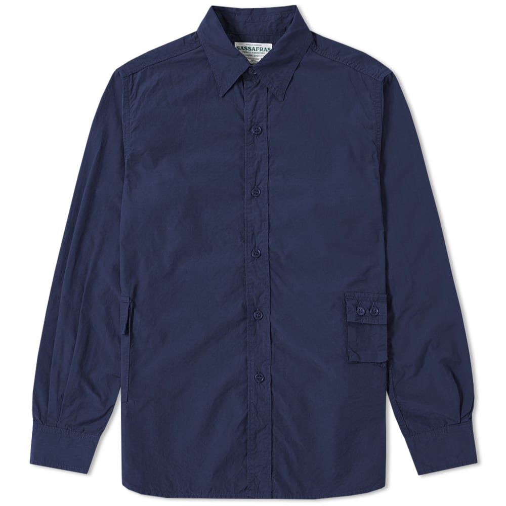 Work, military and outdoor wear come together to inspire the creative outputs of Japanese label Sassafras. Since its founding in 2004, this brand continues to produce functional, comfortable and heavy duty menswear apparel. 
The G.D.U Shirt comes cut from a ripstop cotton and features tonal button down fastenings and multiple pockets throughout. A piece that is built with both from and function in mind, this lightweight staple will see you through seamlessly through from season to season.  

100% Cotton
Ripstop Construction
Tonal Button Down Fastenings 
Multiple Pockets Throughout
Made in Japan