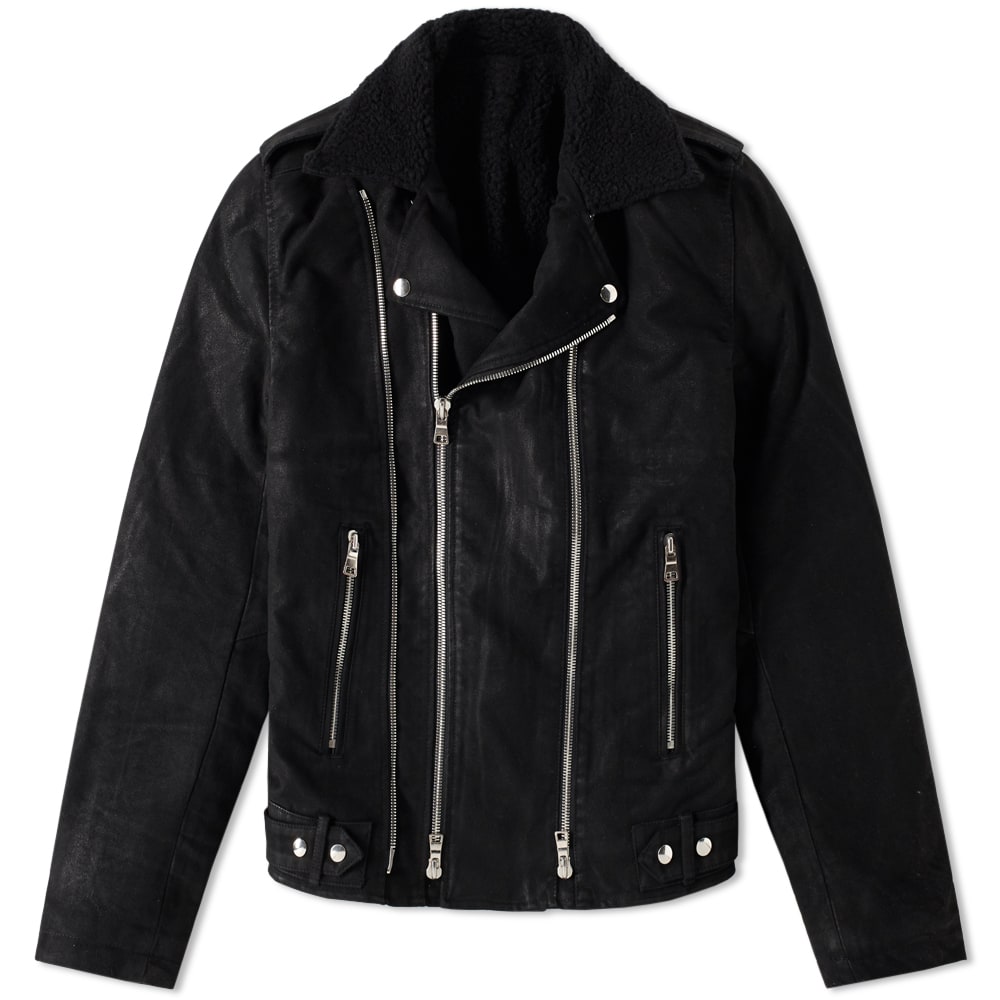 What began in 1945 as a couture house in Paris has today evolved into one of the most sought-after labels in the world. Today Balmain balance the traditional techniques of their past with the strikingly bold aesthetic designer Olivier Rousteing has become known for.The world of biker apparel is always heavily referenced in Rousteing's collections, with his contemporary biker jacket updates standing as true trophy pieces in the fashion scene. This moleskin iteration is styled with a soft wool lining designed to resemble sheepskin. Dual zippers flank the jacket's front whilst shoulder epaulettes lend the jacket a subtle military touch.

Cotton Moleskin
Wool Sheepskin-Effect Lining
Adjustable Side Tabs
Dual Zip Entry
Zipped Front Pockets
Internal Pocket
Zipped Cuffs
Made In Japan