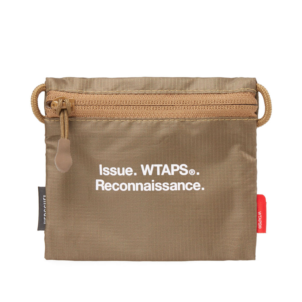 A collaboration to help the modern man combat daily life, WTAPS and the Herschel Supply Co. have designed a five-piece range of military-inspired basics. Among the highlights, the zip pouch will help battle a considerable amount of loose change from subsiding in your pockets. Marked with dual branding, the lightweight 70D ripstop fabric and military hues round off the capsule collections vibes.

70D Ripstop Nylon Shell
Zip Closure
Printed Dual Branding