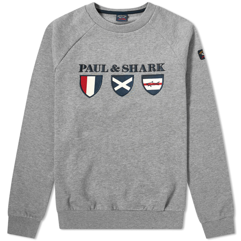 At home on the high seas or on dry land, this heather grey sweater from Paul & Shark boasts a comfortable raglan sleeves construction that’s made to be layered. Inspired by sailing, its nautical shield decoration is topped with the Italian brand’s moniker, proudly embroidered in navy blue.
 
100% Cotton
Raglan Sleeves
Appliqué Branding
Embroidered Branding 
Ribbed Trims
Made in Italy