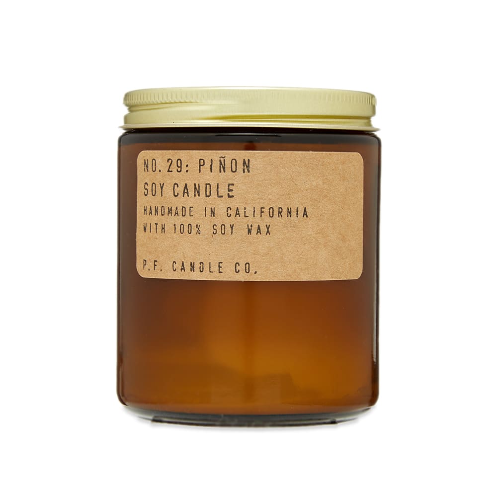 Hand-poured in P.F. Candle Co.’s native L.A., this No.29 Pinon candle is housed in an apothecary-inspired amber-tone jar. Capturing notes of pine, this soy scented piece boasts earthy notes of balsam and spicy black pepper; while light vanilla and smoky cedarwood add warmth to achieve a cultivated but intimate final product.

7.2oz 
Soy Wax
Top Notes: Pine, Balsam Fir
Mid Notes: Amber & Black Pepper
Base Notes: Vanilla, Cedarwood, Cinnamon
40 – 50 Hours Burn Time 
Also Available as Incense
Made in the USA