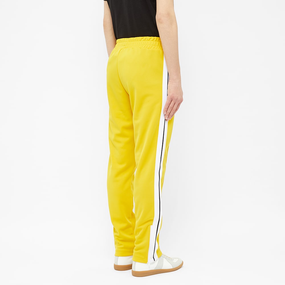 yellow and white track pants