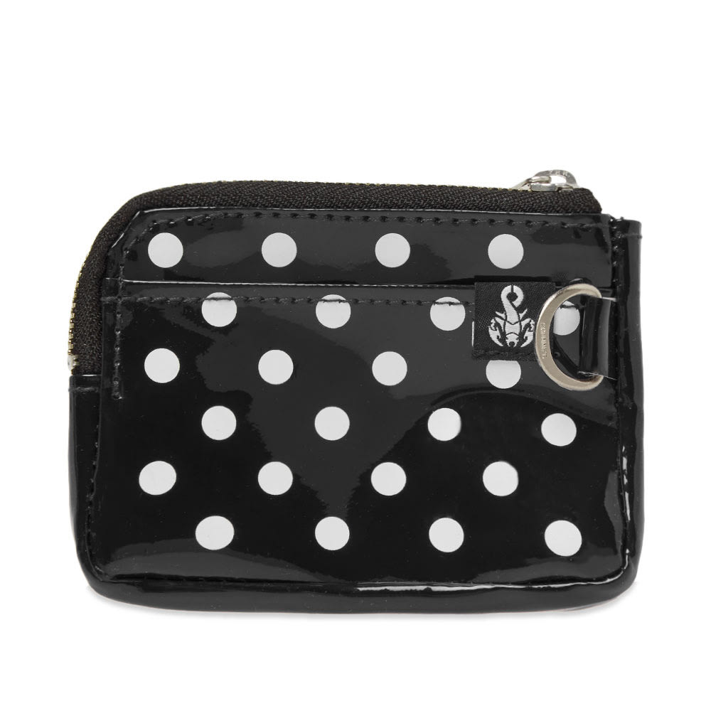 A glossy black storage option from Japanese label SOPHNET., the brand’s dot coin purse is the perfect choice for keeping your loose change in one place. With the ability to secure onto trousers or enlarged accessories with its D-ring detail, the black and white design features a secure zip closure, single card slot and is complete proudly with a branded woven tab.

PVC Construction
Zip Coin Pocket
Card Slot
D-Ring Detailing
Woven Brand Tab