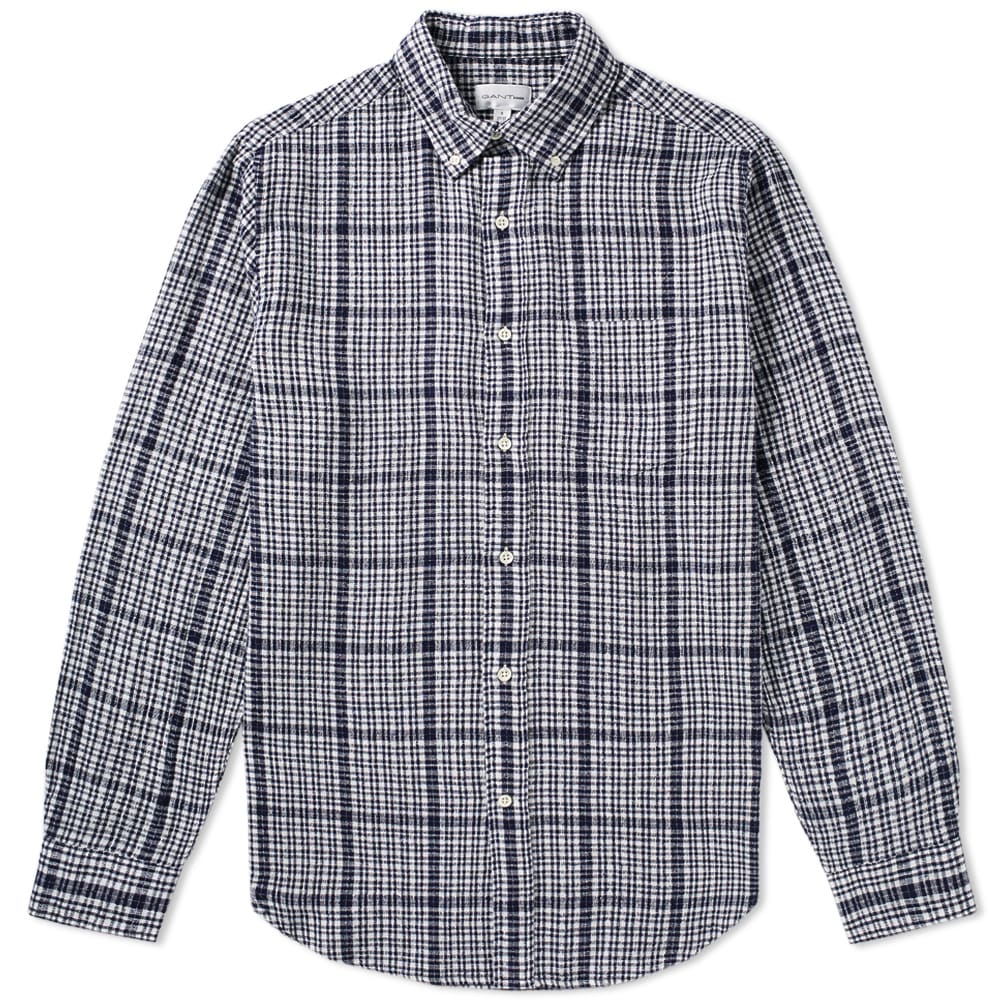 Designed with a distinctive air of classic Americana, GANT Rugger have cut this quality piece of shirting to a loose fit using the bouclé technique. The even effect across the garment adds a beautiful finish, finished with the traditional button-down collar, adjustable cuffs, pointed chest pocket, and their iconic box pleat and locker loop on the back.

96% Cotton, 4% Linen
Bouclé Technique 
Button Down Collar
Chest Patch Pocket
Box Pleat & Locker Loop