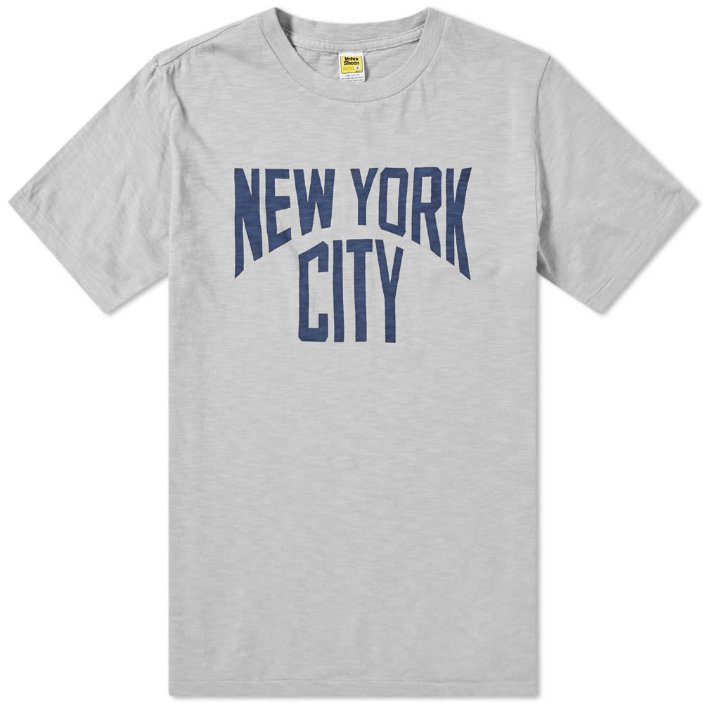 Taking a bite out of the ‘Big Apple’, Velva Sheen deliver this sports-inspired tee with the city’s name splashed proudly across the chest. Promising vintage athleticism with a faded grey colourway, the simple short sleeve tee is made in the USA for a truly authentic, homegrown finish.

100% Cotton
Ribbed Crewneck
‘New York City’ Print
Made in the USA