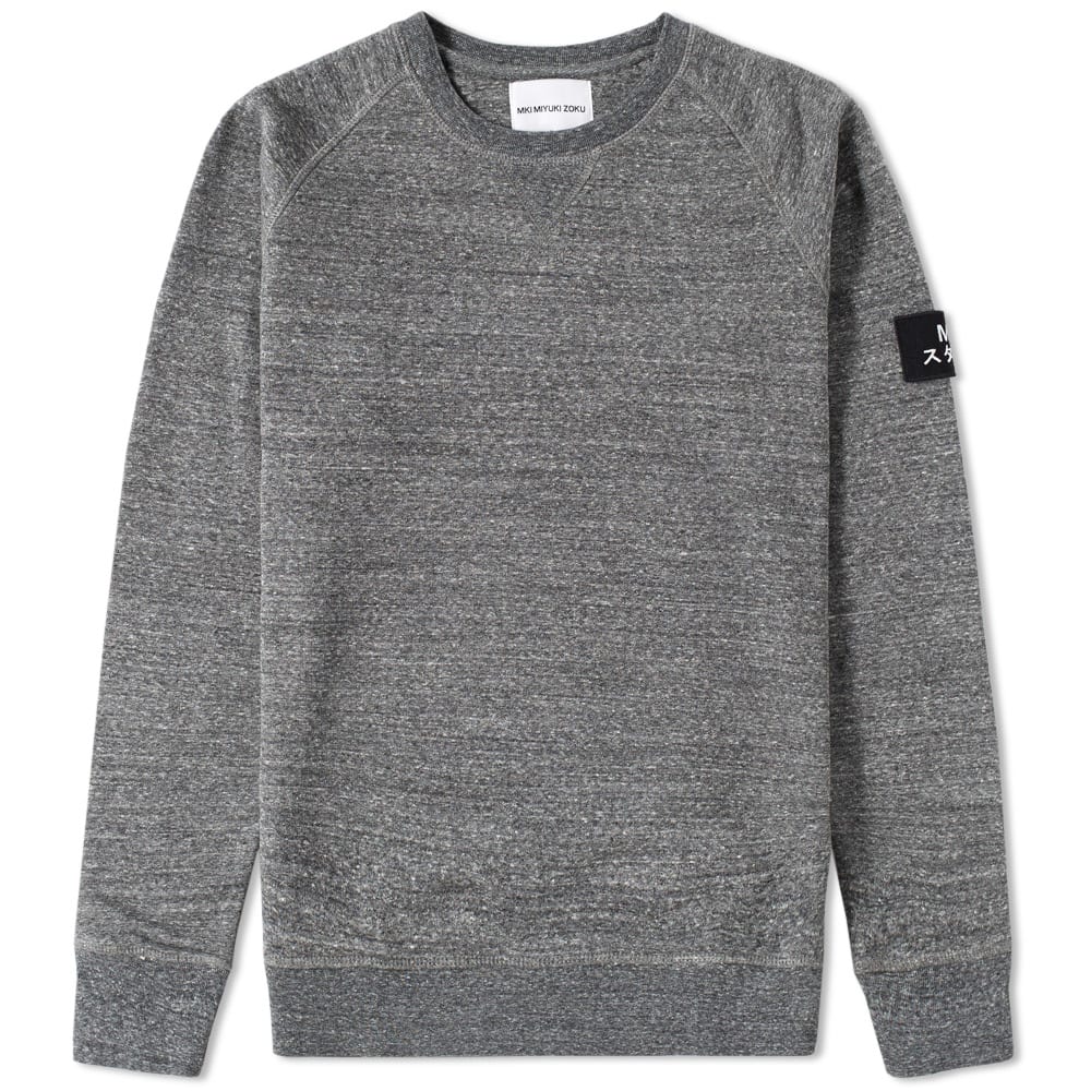 Offering designer products and quality garments, the MKI collections are created to be both accessible in wear-ability and affordability - adopting elements from the Japanese youth tribe who loitered in the upscale Ginza shopping neighbourhood. Devotees of classic American collegiate style, the MKI Badge Sweat is constructed from an Organic Cotton blend with custom felt badge to left arm.

Organic Cotton Blend
Combed Outer
French Terry Inner
Ribbed Crew, Cuffs and Hem
V-Stitch Insert
Felt Badge to Sleeve