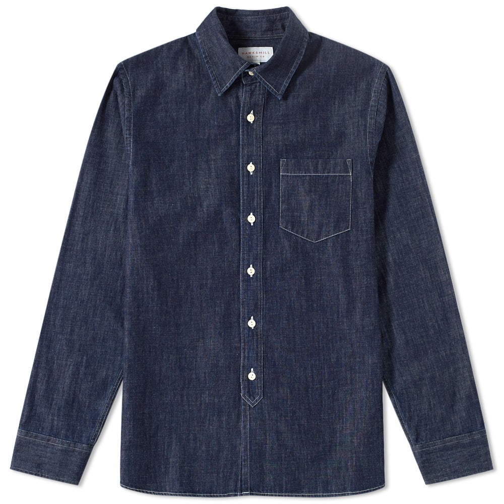 Based in Great Britain, Hawksmill Denim Co. believe in creating well-made, authentic garments, designed to shun cyclical fashion trends in favour of good design and longevity.
The Japanese Chambray Shirt has a classic fit and is cut from a rinsed Japanese chambray. Playing host to a simple construction this piece of shirting features a single pocket to the chest and external stitched details to its Mother of Pearl button down placket.

100% Cotton Japanese Chambray
Classic Fit
Mother of Pearl Button Down Fastenings
Patch Pocket To Chest