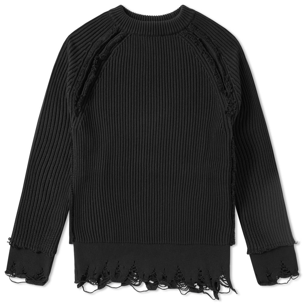 With an artful sense of distress arriving as one of the season's most prolific trends, Haider Ackermann’s heavyweight cotton knit hits the trend firmly on the head. Styled with raw construction to the raglan sleeves and an uneven, distressed hem, the knit effortlessly layers atop a jersey tee to create the multi-proportioned look the designer has become known for.

90% Cotton 10% Cashmere
Thick Ribbed Knit
Distressed Seams
'Moth Eaten' Effect Hem
Made In Italy