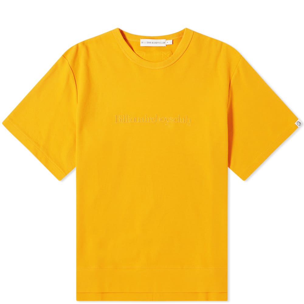 Finished in autumnal hues and ready for the approaching colder months, Billionaire Boys Club introduces this heavyweight piqué cotton t-shirt. With an oversized fit and wearing an exaggerated split hem, a locker loop to the reverse is joined by tonal embroidery and a woven tab, branding the eye-catching orange tee and completing the street-ready look.100% CottonPiqué FabricRibbed CrewneckLocker LoopEmbroidered BrandingWoven Brand TabSplit Hem