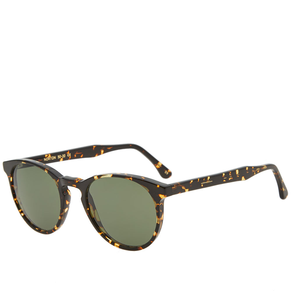 A famed fixture of L.G.R's eyewear portfolio, the Norton sunglasses are designed classically in the label’s ‘Panthos’ shaping. With all components crafted skilfully in Italy, this premium pair are proven with the utmost quality and are stationed within a hand polished cellulose acetate frame. Perfectly suited to both men and women, the elegant accessory offering is graced in a Havana sucro and green print, while an anti-reflective coating and 100% UV and infrared protective lenses work in tandem to prevent optical damage from the intense essence of the sun.

Cellulose Acetate Frame
Mineral Glass G15 Lenses
100% UV Protection
Filter Category: 3
Anti-Reflective Coating
Oleophobic & Hydrophobic Coating
3 Barrel Hinge
Anti-Scratch
Engraved Branding
Handmade in Italy