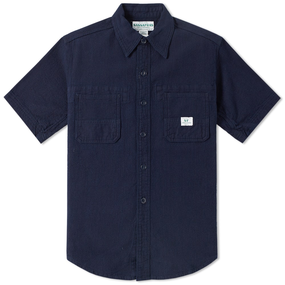 A concept that goes far beyond garden attire, Sassafras takes unique elements of workwear and creates functional, comfortable and heavy duty clothing. A niche Japanese label that started out in 2004, has now established itself in rich clothing intended for garden use – although it works just as well as part of a stylish, durable wardrobe. The Short Sleeve Gardener Shirt is expertly crafted in Japan, cut from a textured cheesecloth-like cotton fabric and boasting a plethora of utility pockets for garden-specific and everyday functionality.

100% Cotton
Textured Cheesecloth-Like Fabric
Full Button Closure
Sassafras Pocket Tag
Multiple Utility Pockets
Turn-Down Pointed Collar
Made in Japan