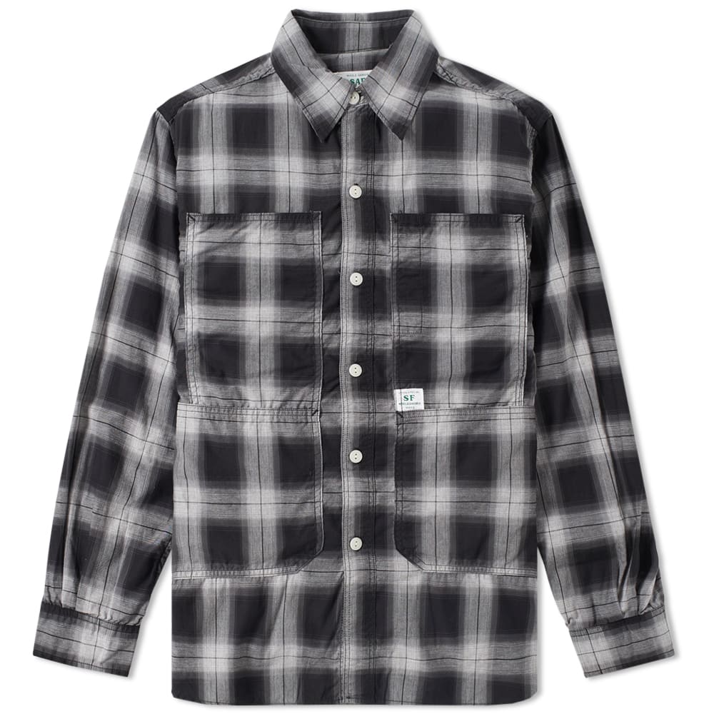 A concept that goes far beyond garden attire, Sassafras takes unique elements of workwear and creates functional, comfortable and heavy duty clothing. A niche Japanese label that started out in 2004, has now established itself in rich clothing intended for garden use – although it works just as well as part of a stylish, durable wardrobe. The Transplant Chore Shirt takes on the utilitarian detailing of the storied chore coat design but swaps out the heavyweight construction for softer cotton fabrics, maintaining the utilitarian styling with an array of utilitarian pocket detailing.

100% Cotton
Full Button Closure
Curved Hem, Contrast Stitching
Sassafras Pocket Tag
Multiple Front Utility Pockets
Turn-Down Pointed Collar
Made in Japan
