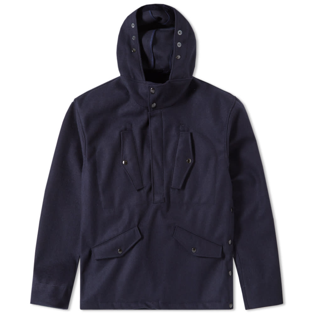 Made entirely in France, Arpenteur modernises French work clothing from the 30s, 40s and 50s into a modern laid-back style, with each silhouette constructed from a fabric that is simultaneously wearable, sturdy and timeless. The Smock Jacket showcases the brand’s keen eye for detailing and considered material use, with multiple front pockets each featuring corduroy to the underside of the snap-closure flaps. An impeccable finish comes as standard with these French outfitters, and this 100% wool pullover silhouette comes complete with snap-closure buttons to one side seam for ease of access and ventilation.

100% Wool 
Corduroy detailing to Pockets & Hood
Single Seam Snap-Closure Buttons
Sunken Ribbed Cuffs
Popover Silhouette
Quarter Button Placket
Made in France