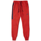 university red nike tech pants