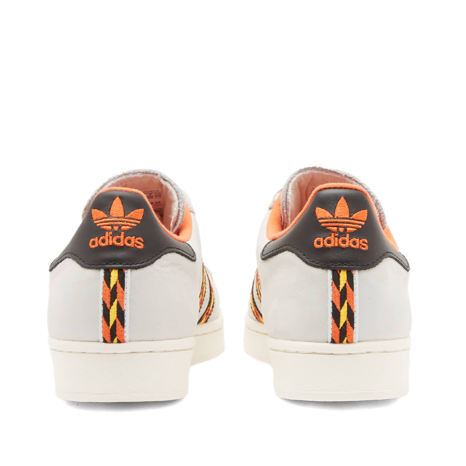 orange and white adidas superstar