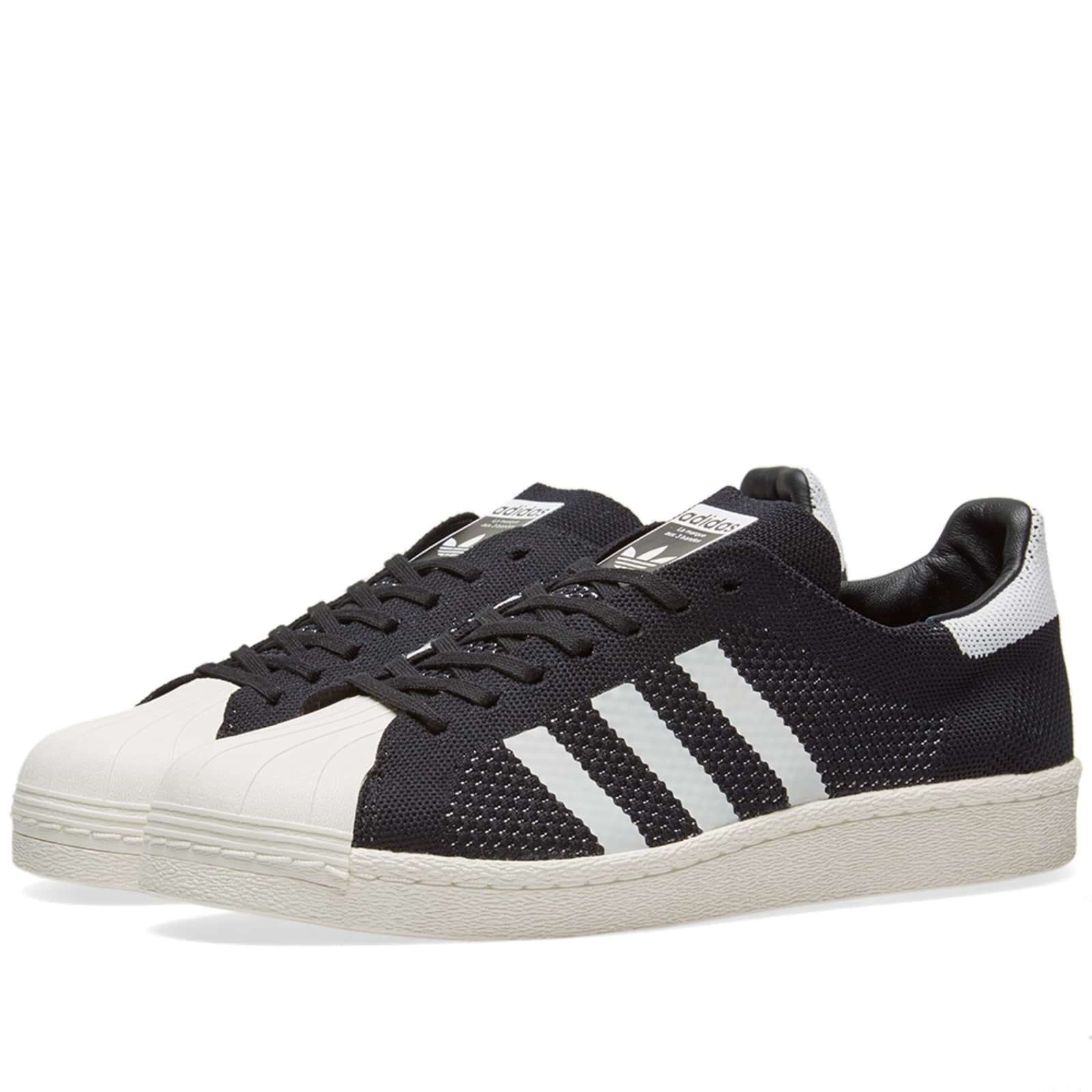 peach and white superstars