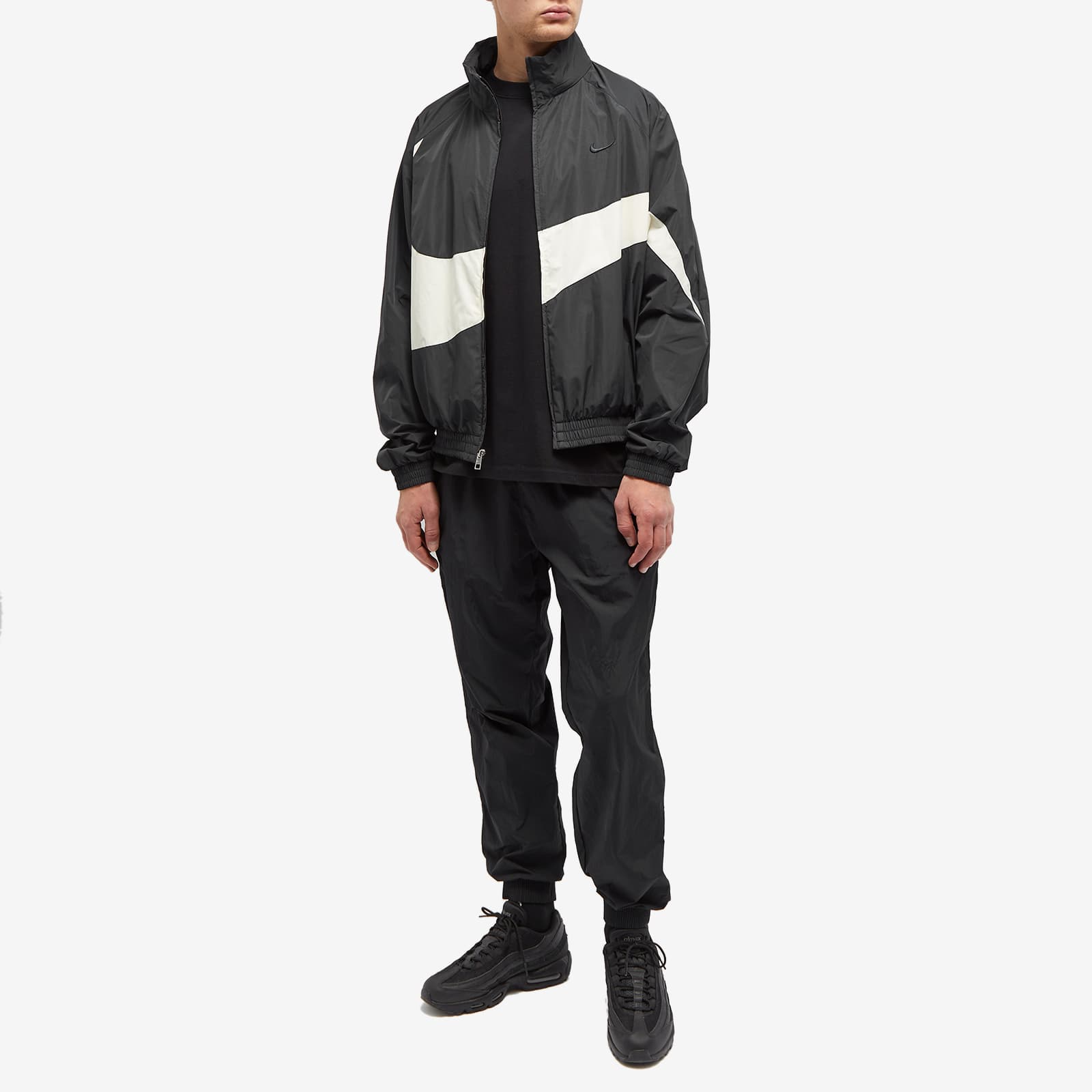nike woven track jacket in black