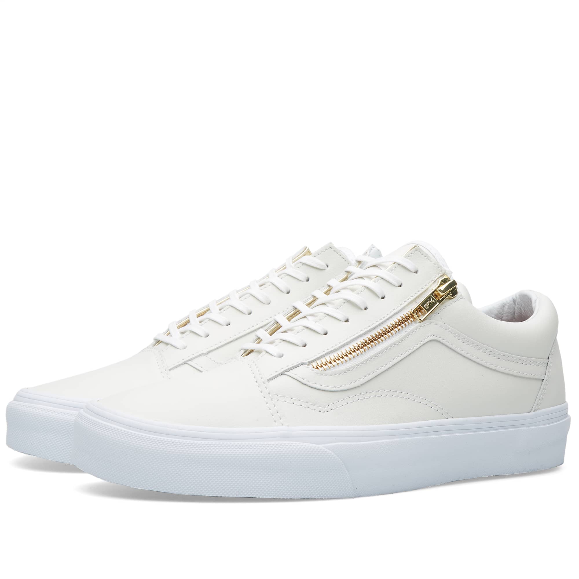 white and gold vans