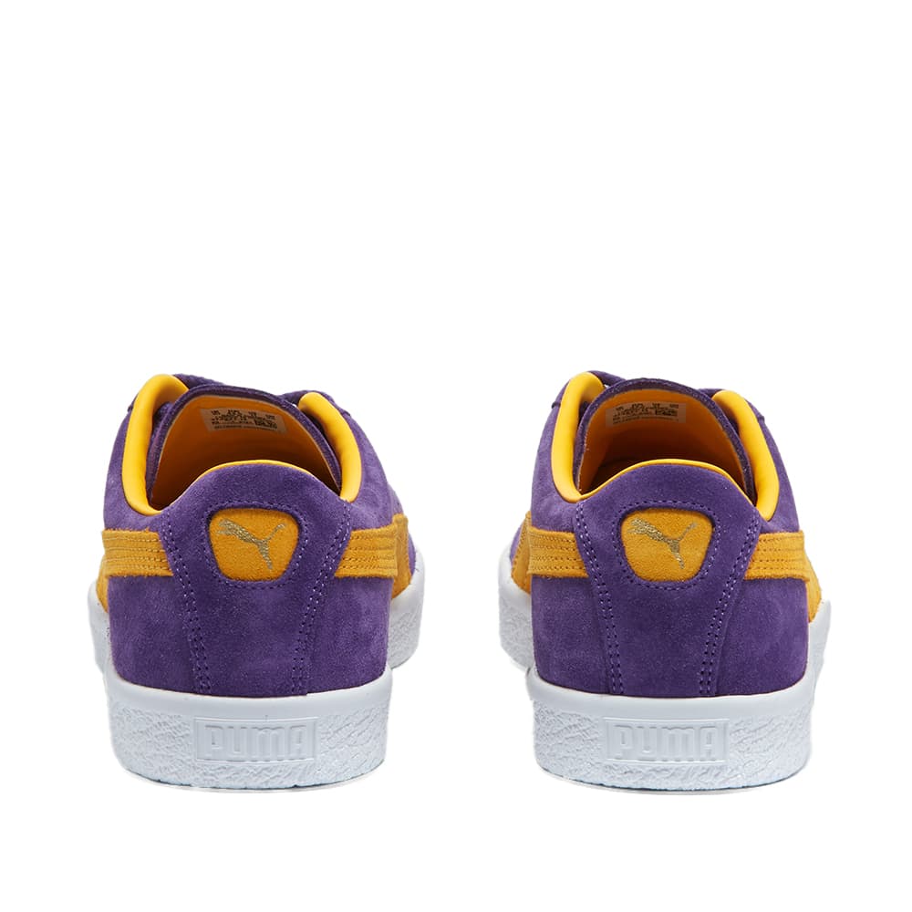 purple and yellow puma suedes