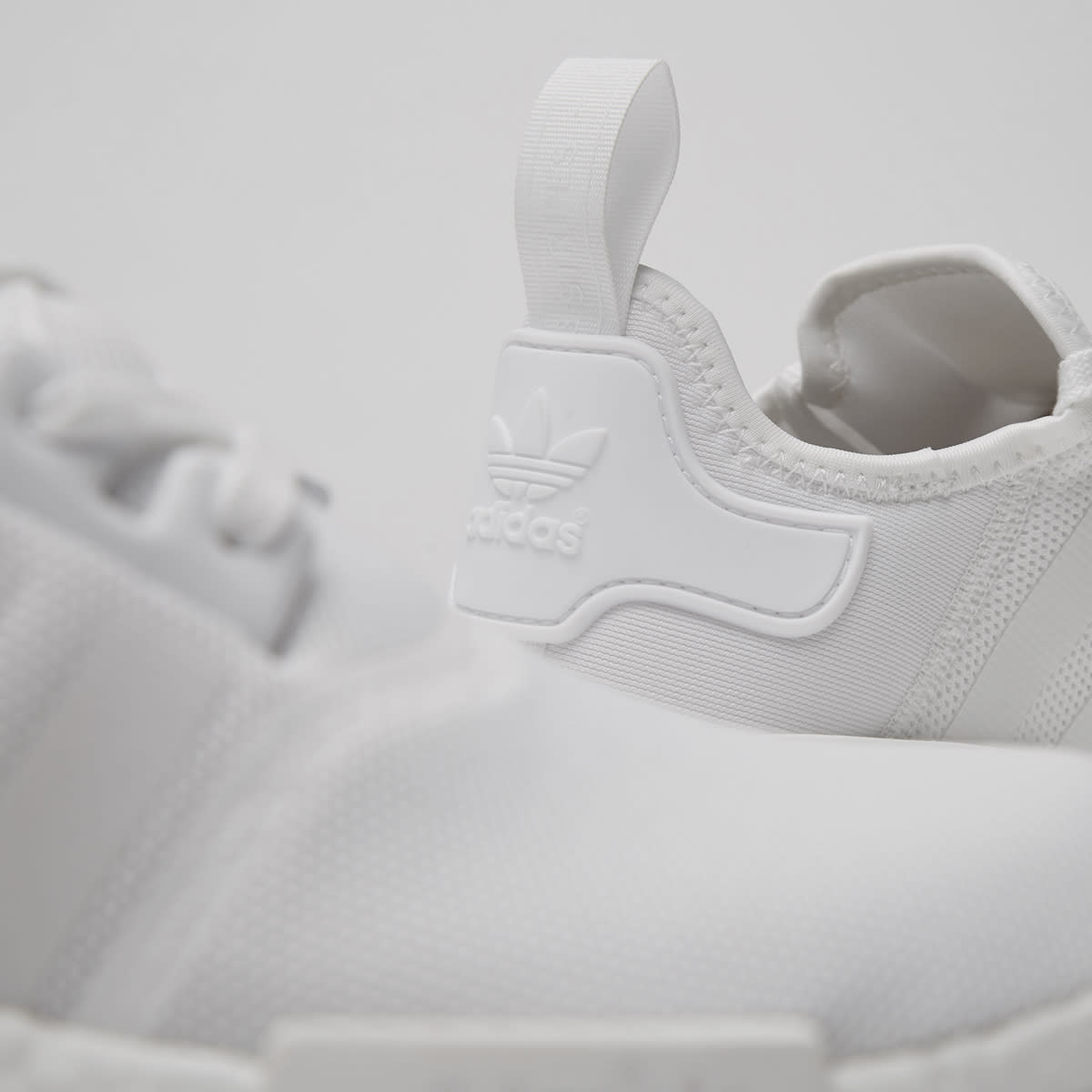 nmd r1 pk triple white