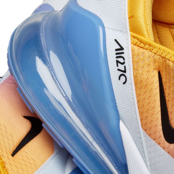 blue and gold nike slides