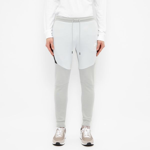 grey and white nike tech pants