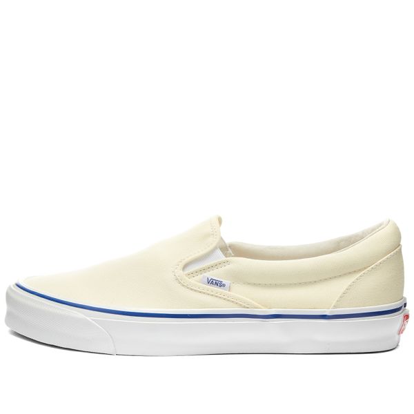 white canvas slip on vans